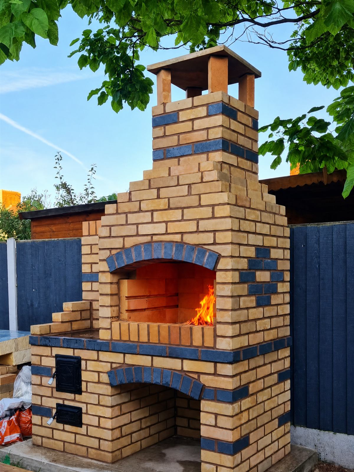 Tan brick BBQ, live-fired and ready to cook